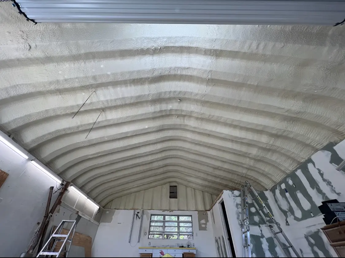 Spray polyurethane foam applied to the underside of a metal roof deck in Delphos